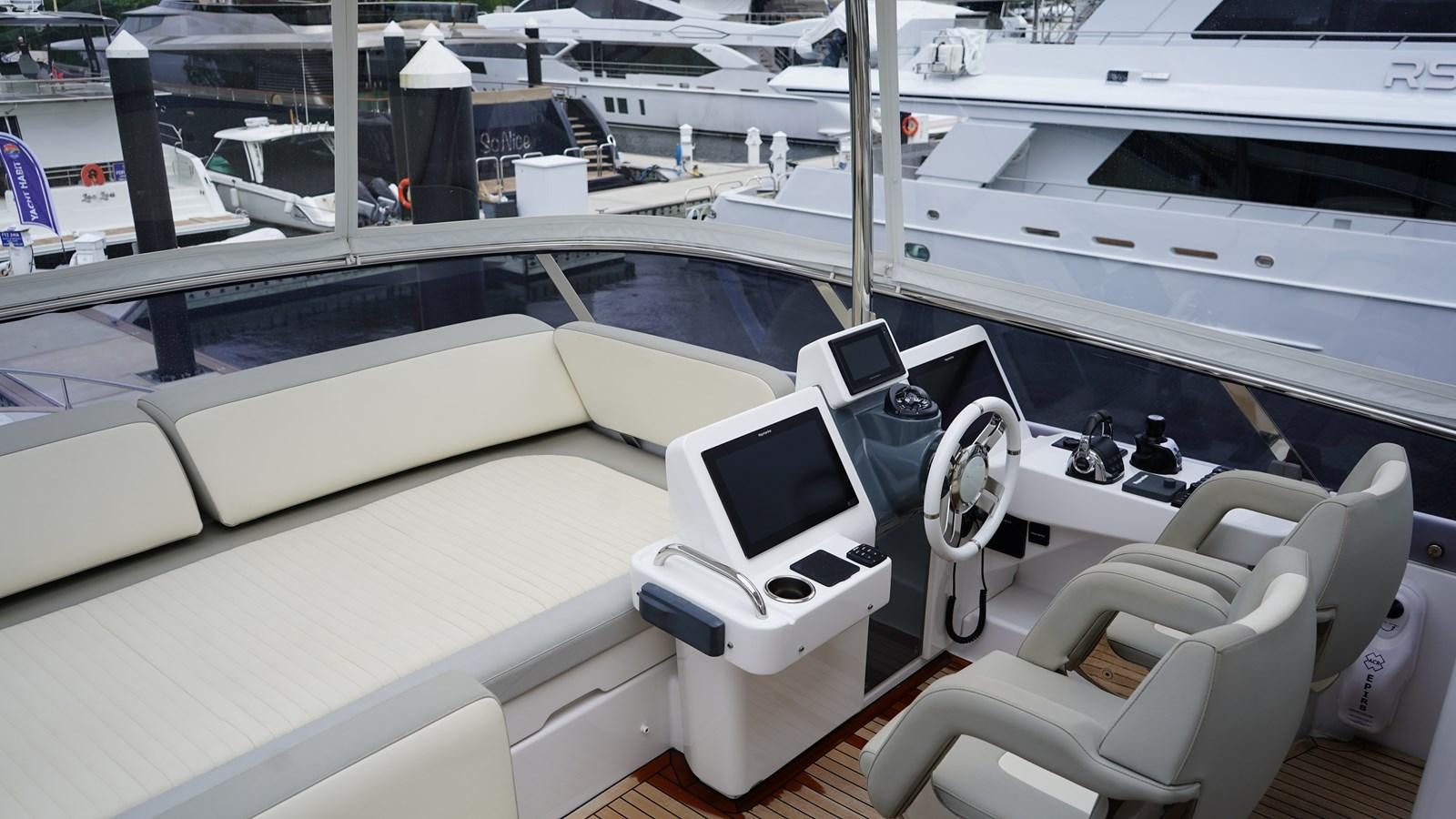 a white yacht with a laptop on it aboard RAINBOW GODDESS Yacht for Sale