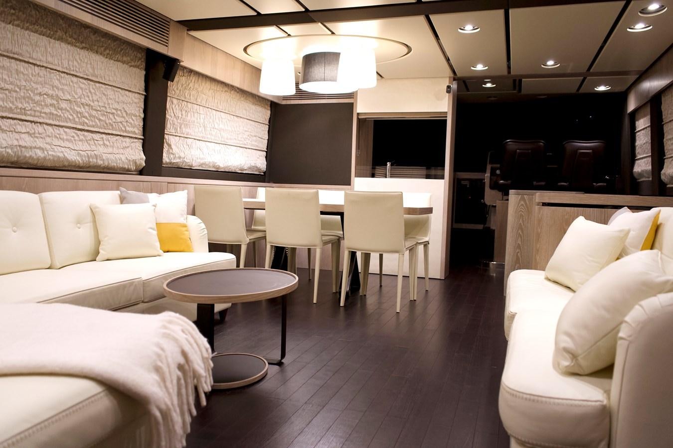 a room with a table and chairs aboard RAINBOW GODDESS Yacht for Sale