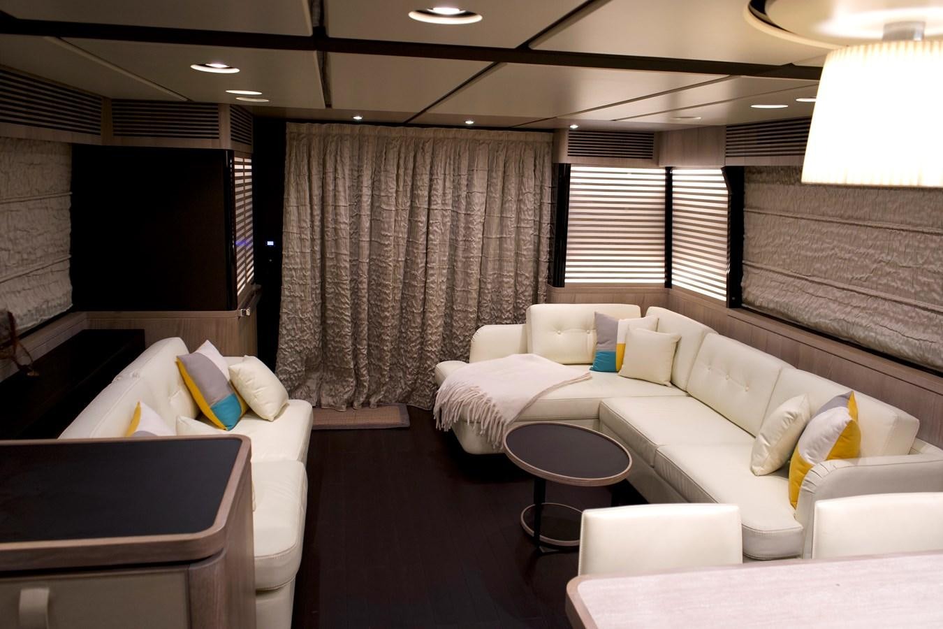 a room with a couch and a table aboard RAINBOW GODDESS Yacht for Sale