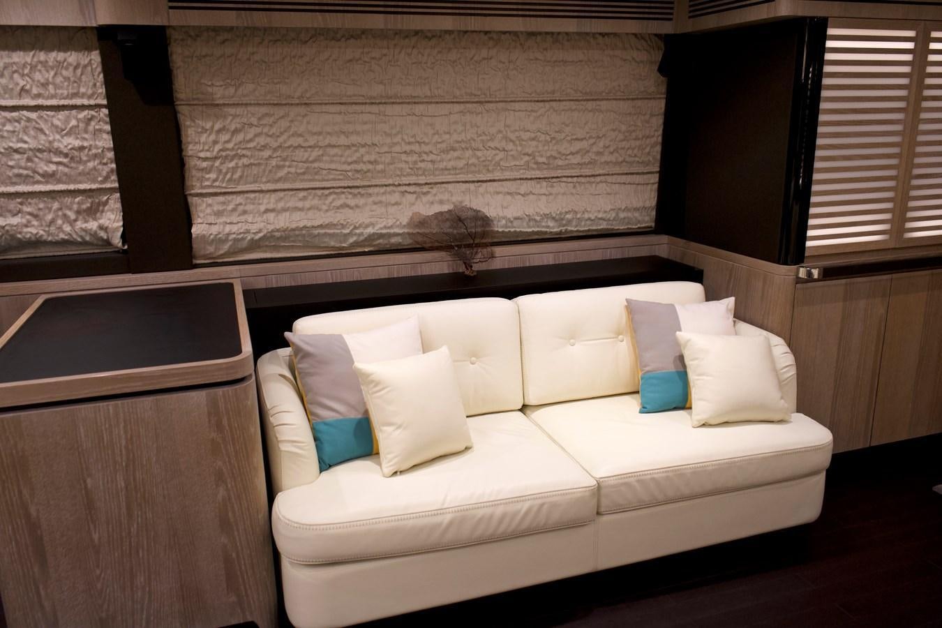 a bed with white pillows aboard RAINBOW GODDESS Yacht for Sale