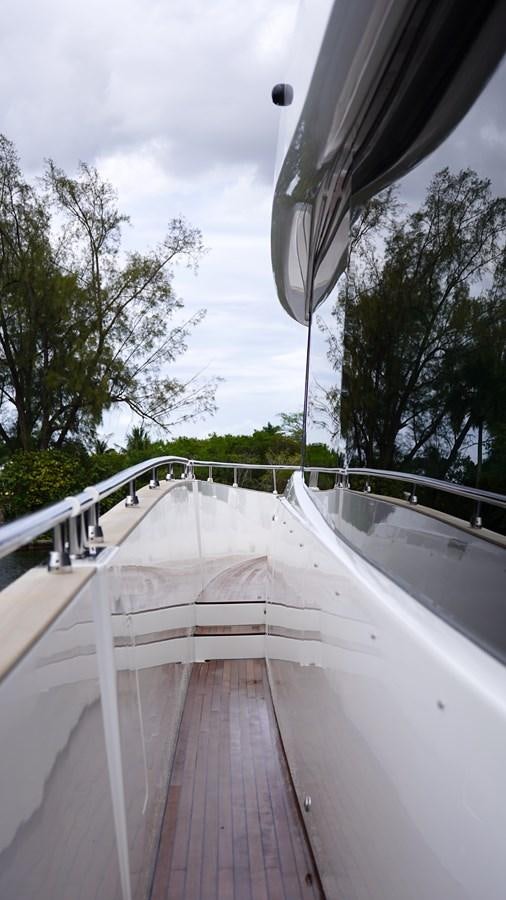 a wooden bridge over water aboard RAINBOW GODDESS Yacht for Sale