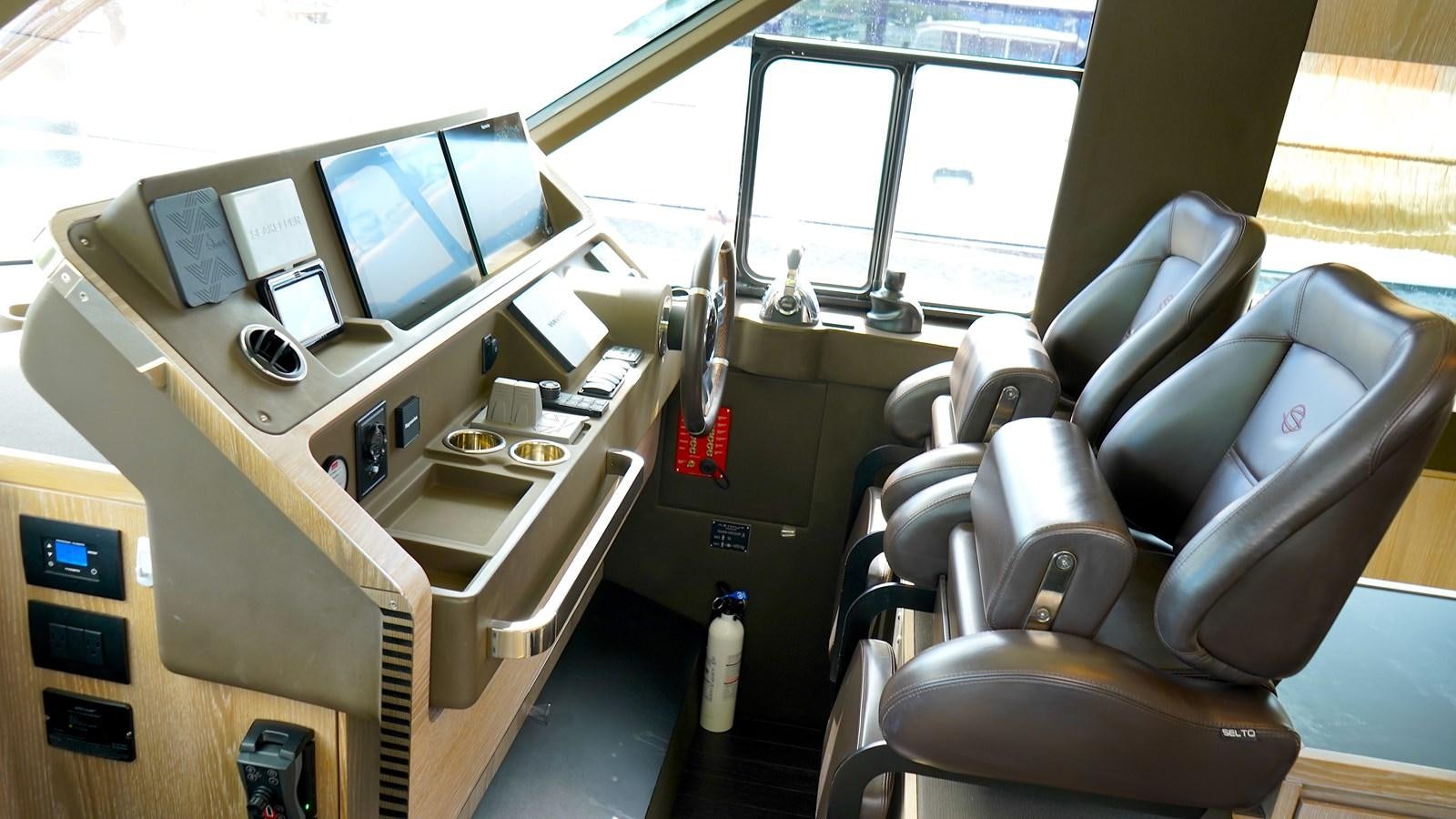 a room with many computers and chairs aboard RAINBOW GODDESS Yacht for Sale