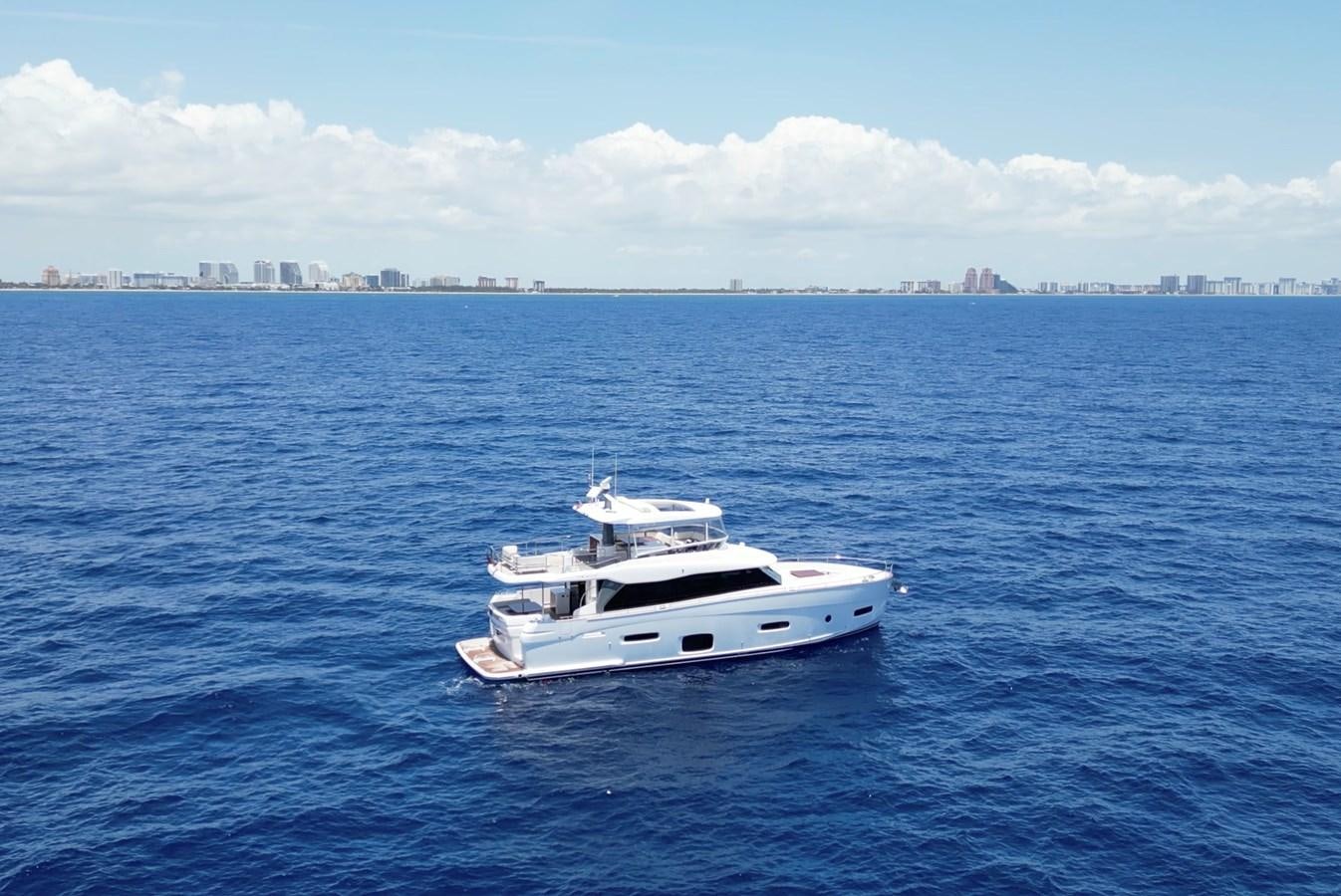 a white boat in the water aboard RAINBOW GODDESS Yacht for Sale