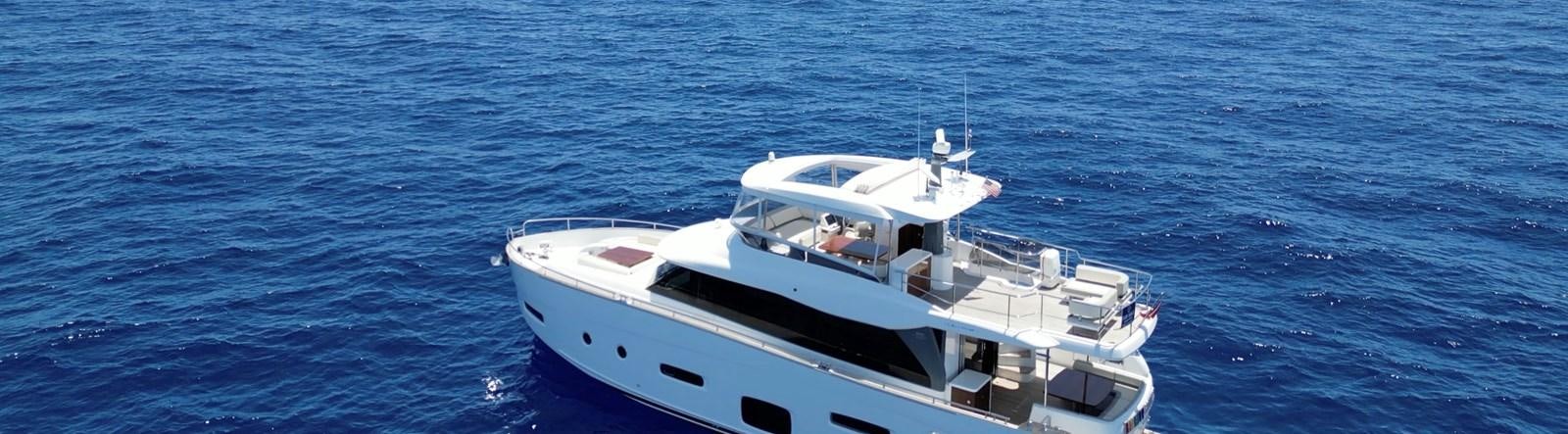 a white boat in the water aboard RAINBOW GODDESS Yacht for Sale