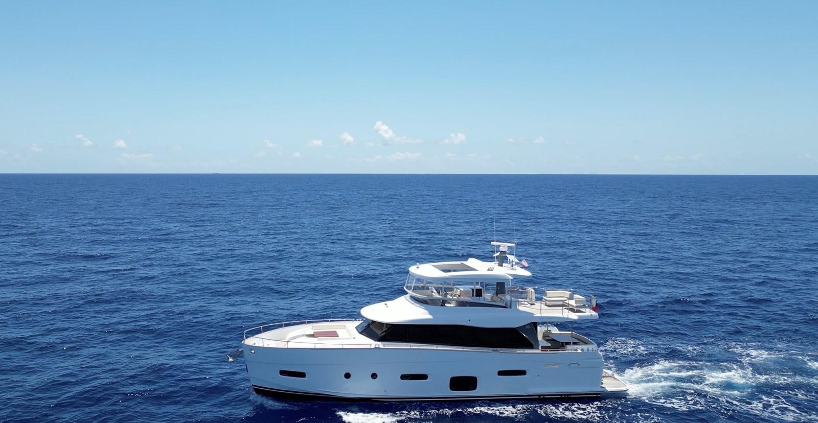 a white boat in the water aboard RAINBOW GODDESS Yacht for Sale