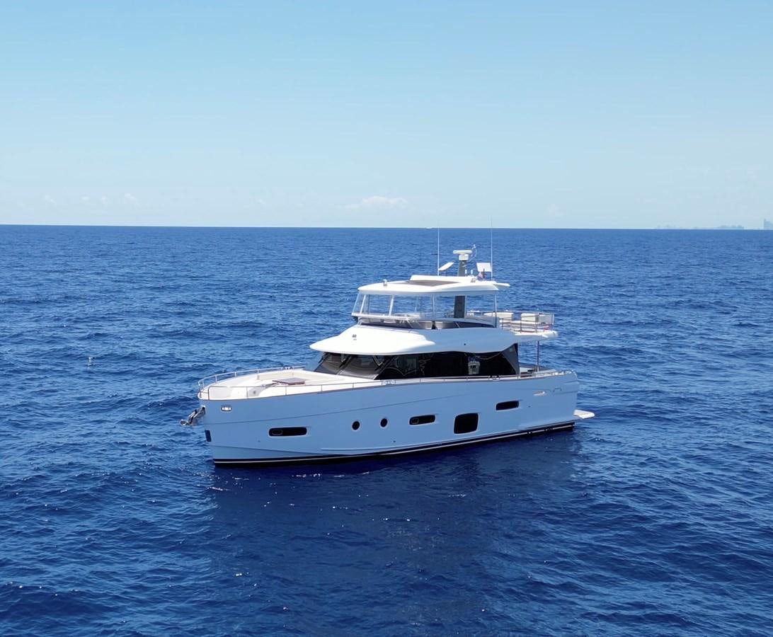 a white yacht in the water aboard RAINBOW GODDESS Yacht for Sale