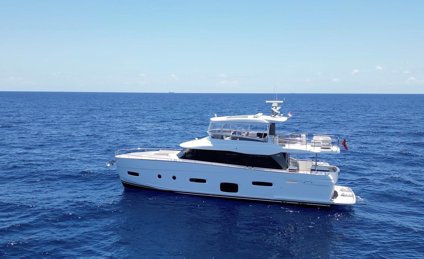 a white boat in the water aboard RAINBOW GODDESS Yacht for Sale