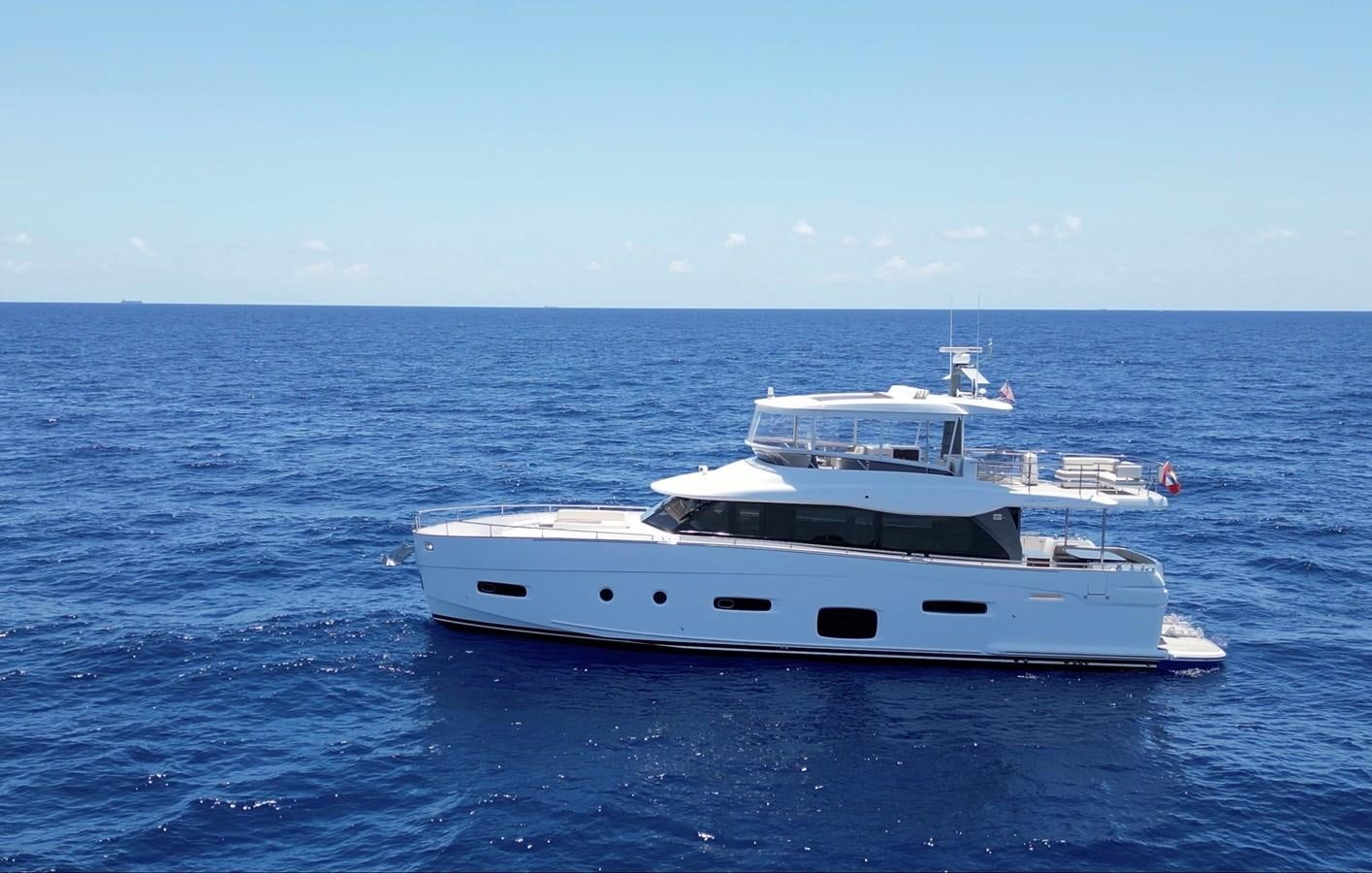 a white boat in the water aboard RAINBOW GODDESS Yacht for Sale