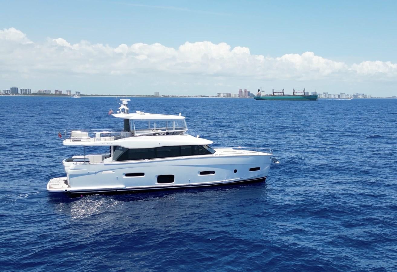 a white yacht in the water aboard RAINBOW GODDESS Yacht for Sale