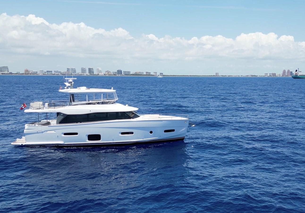 a white yacht in the water aboard RAINBOW GODDESS Yacht for Sale