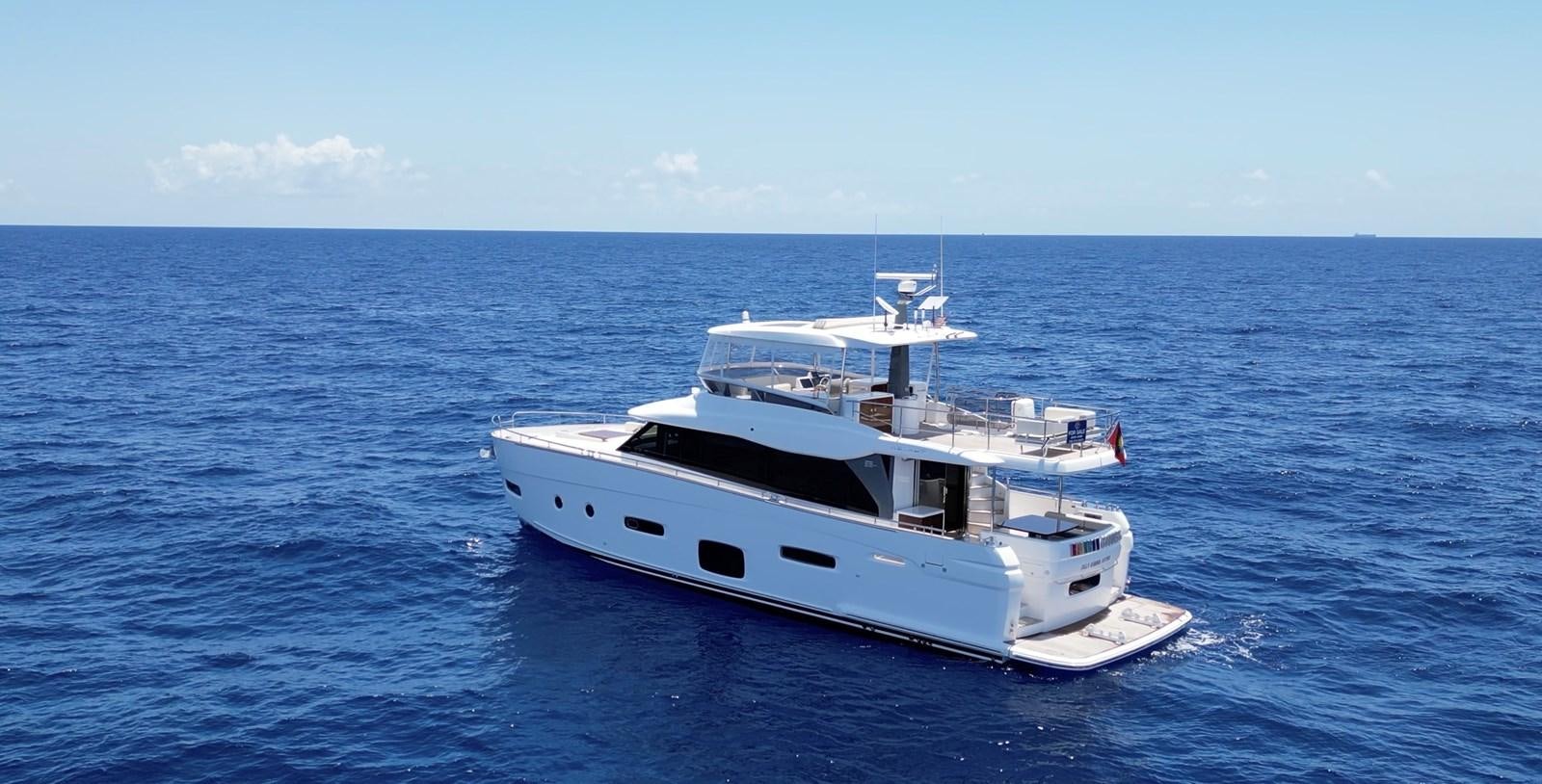 a white boat in the water aboard RAINBOW GODDESS Yacht for Sale