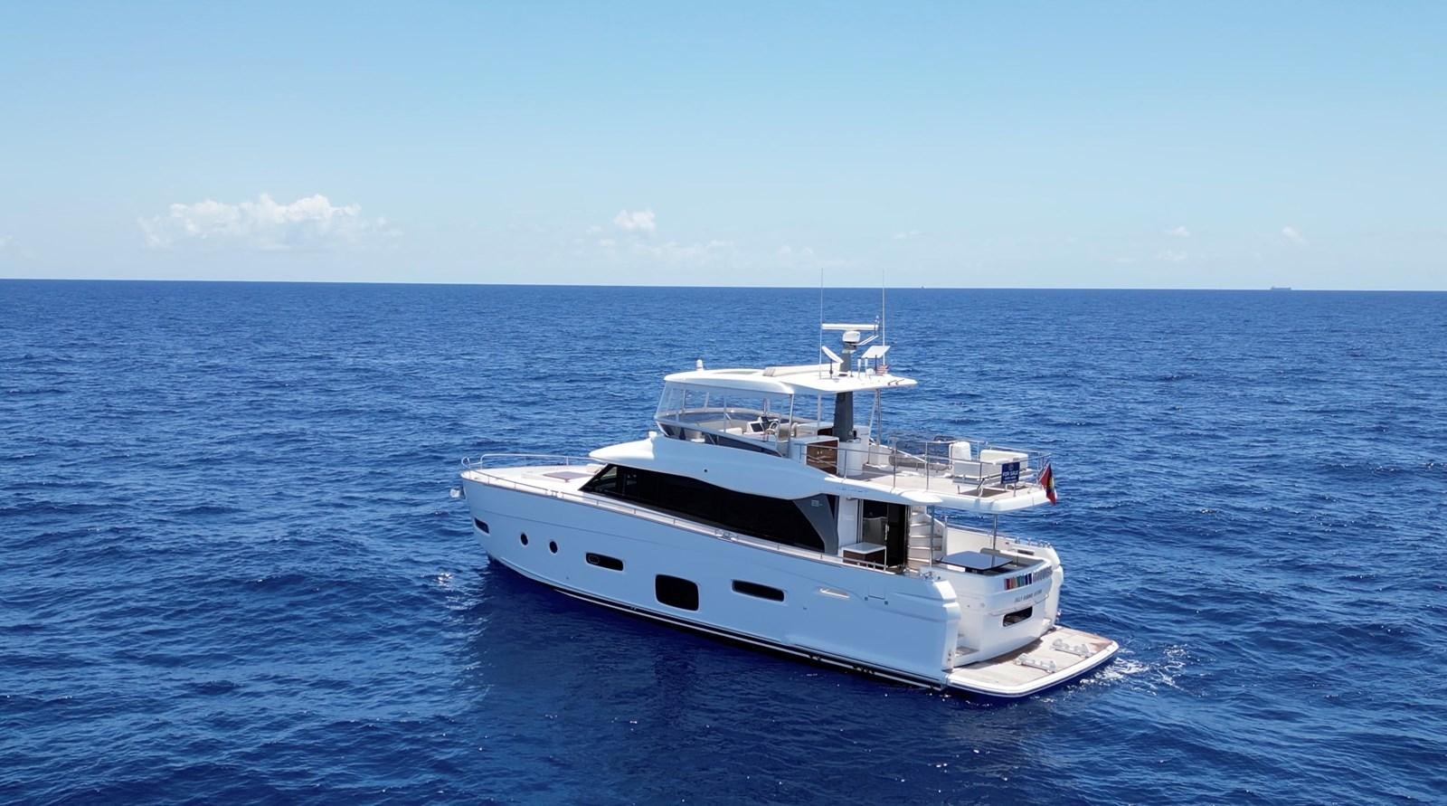 a white boat in the water aboard RAINBOW GODDESS Yacht for Sale