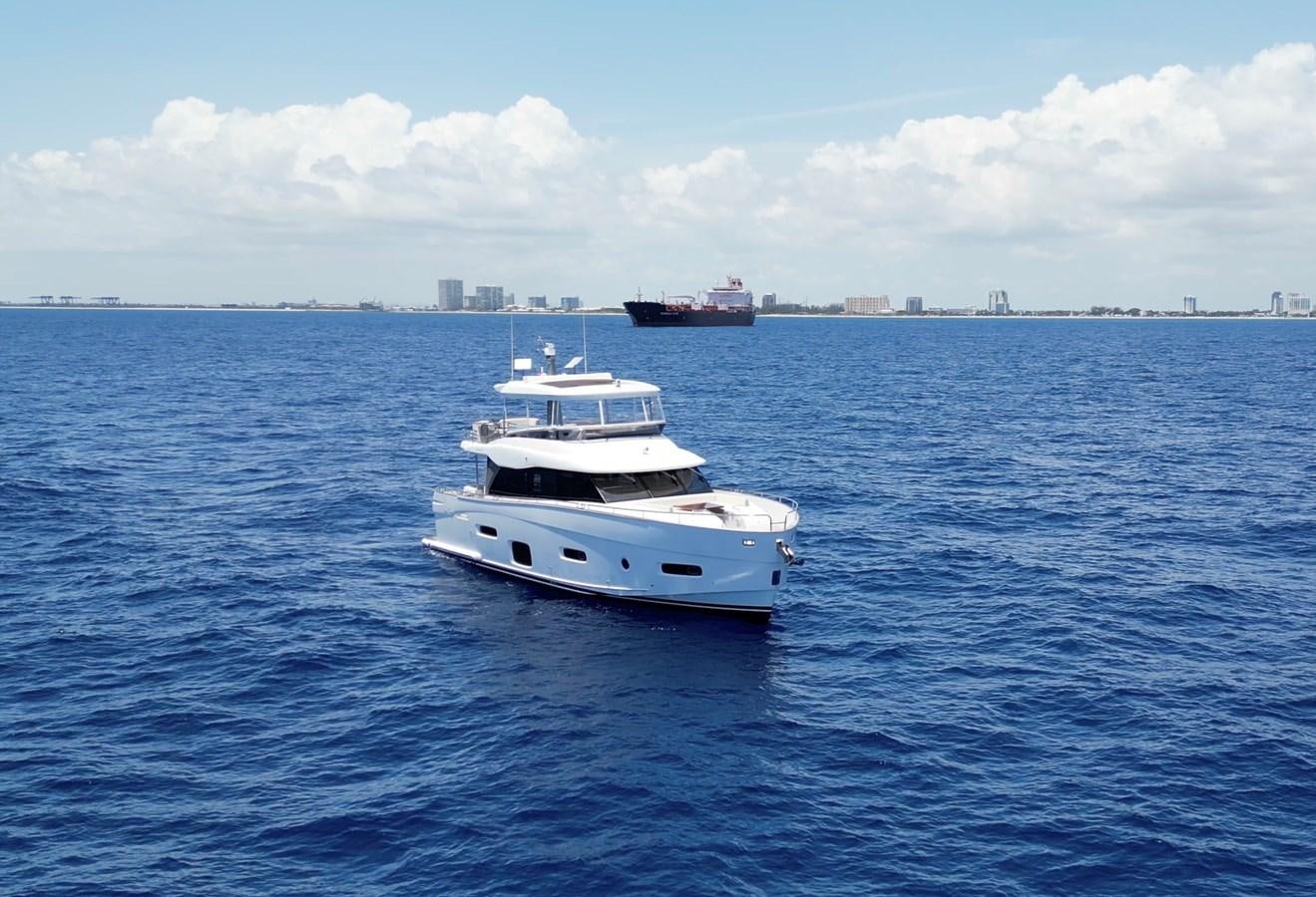 a white boat in the water aboard RAINBOW GODDESS Yacht for Sale