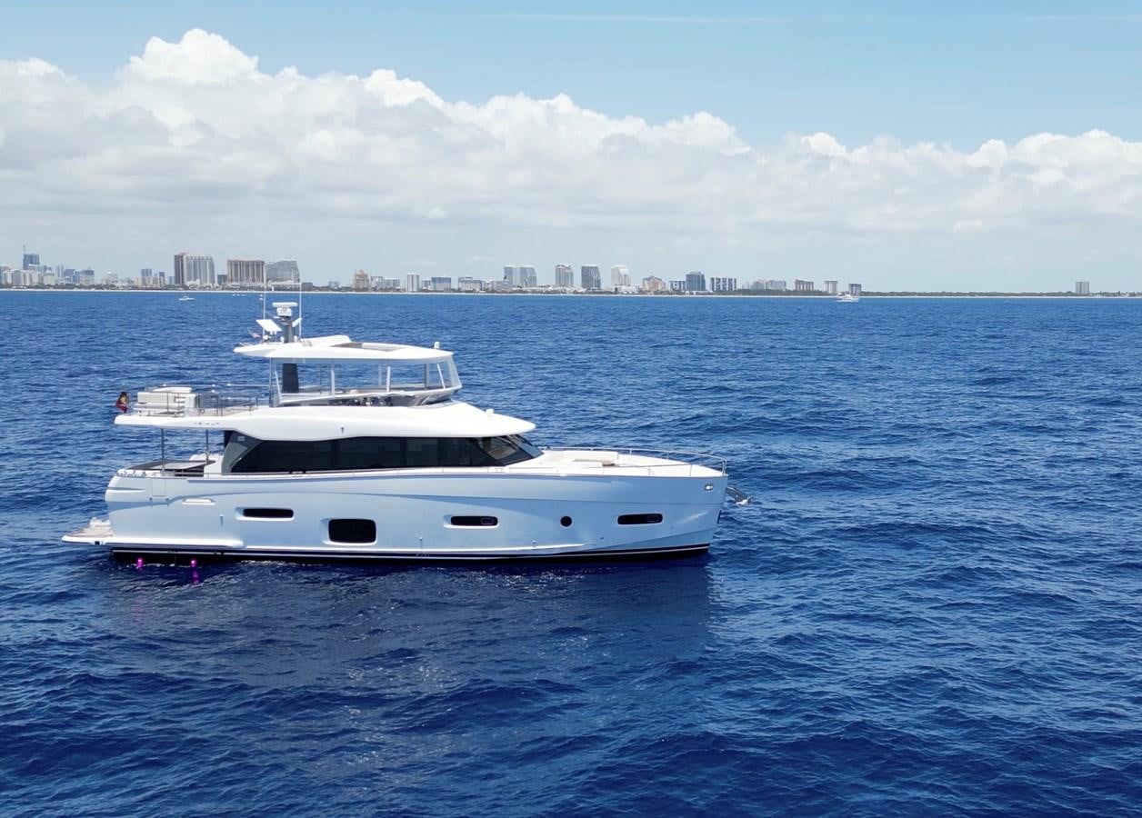 a white yacht in the water aboard RAINBOW GODDESS Yacht for Sale