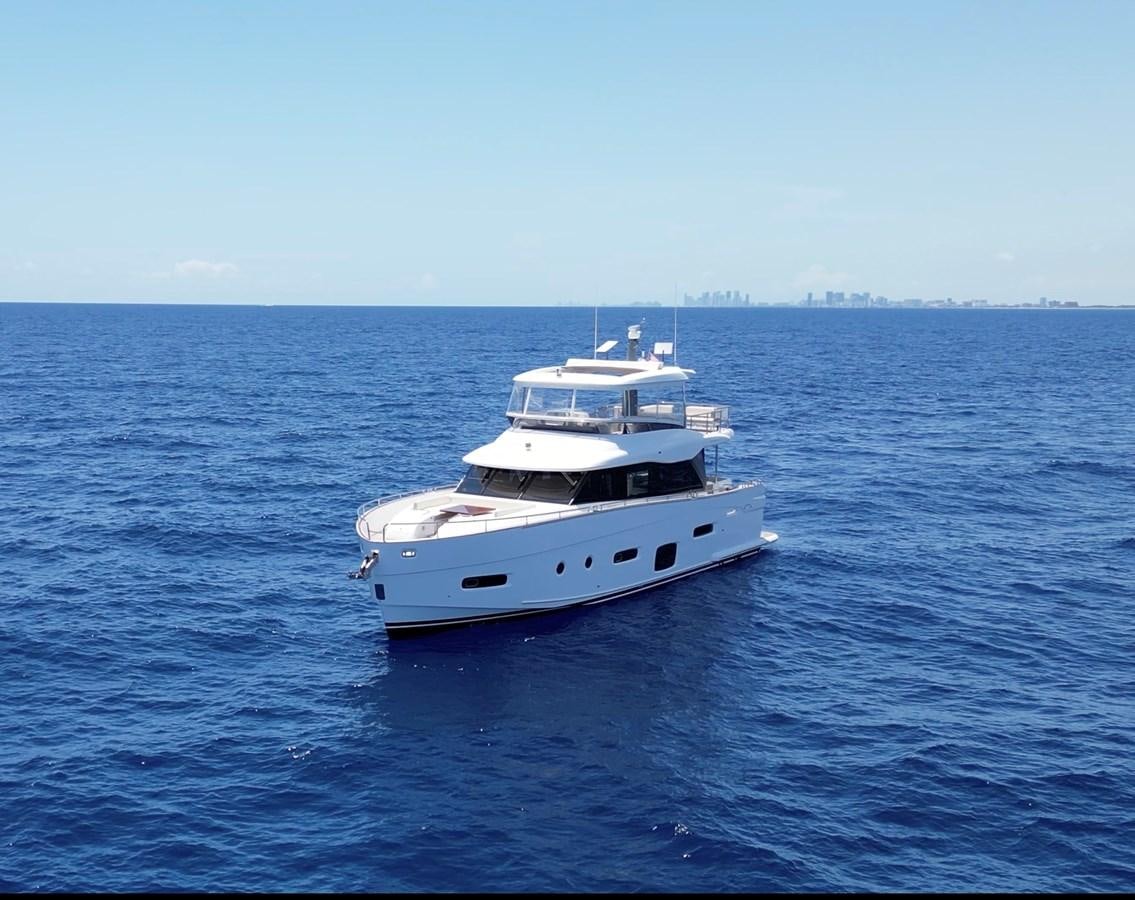 a couple of white yachts in the water aboard RAINBOW GODDESS Yacht for Sale