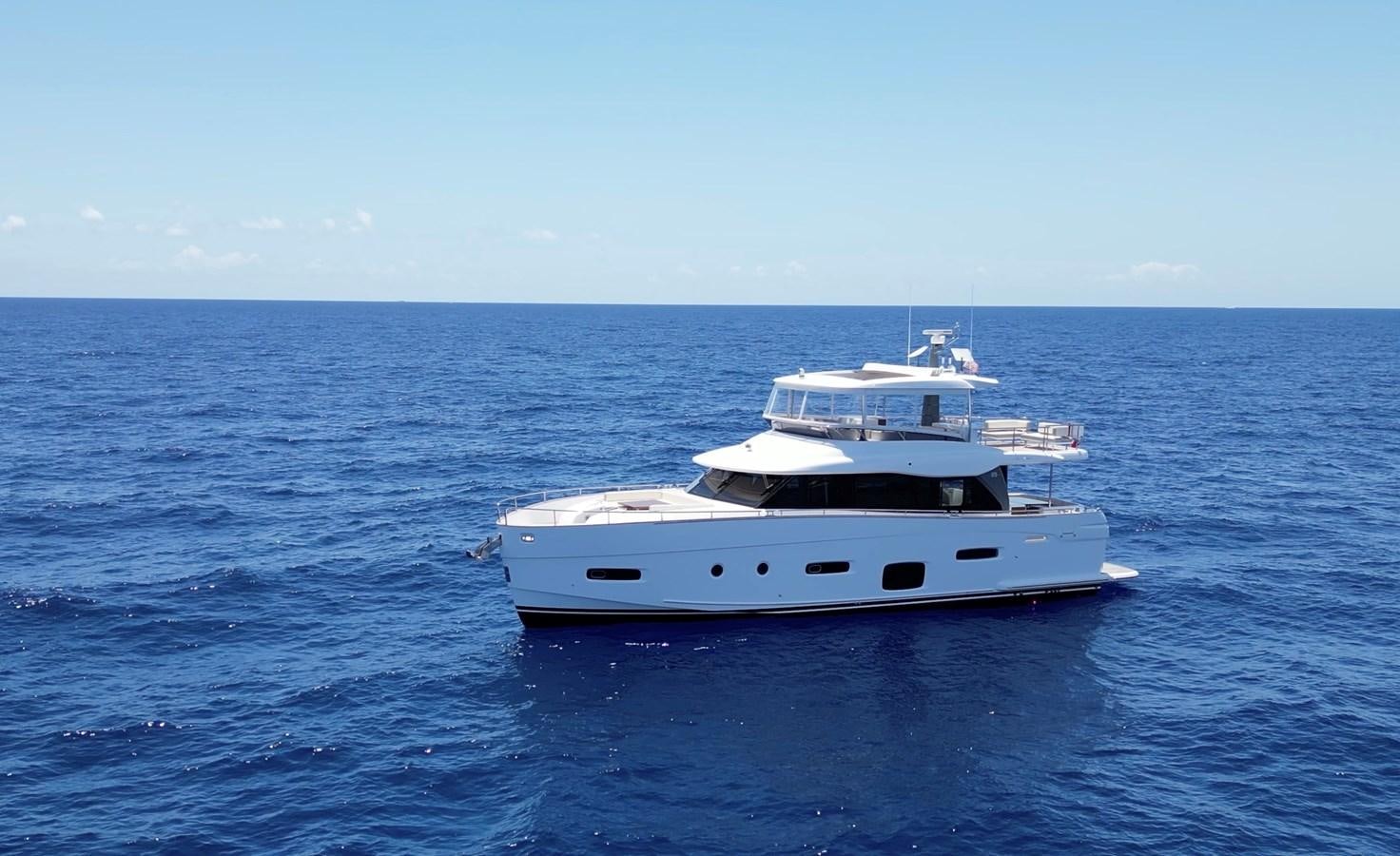 a white boat in the water aboard RAINBOW GODDESS Yacht for Sale