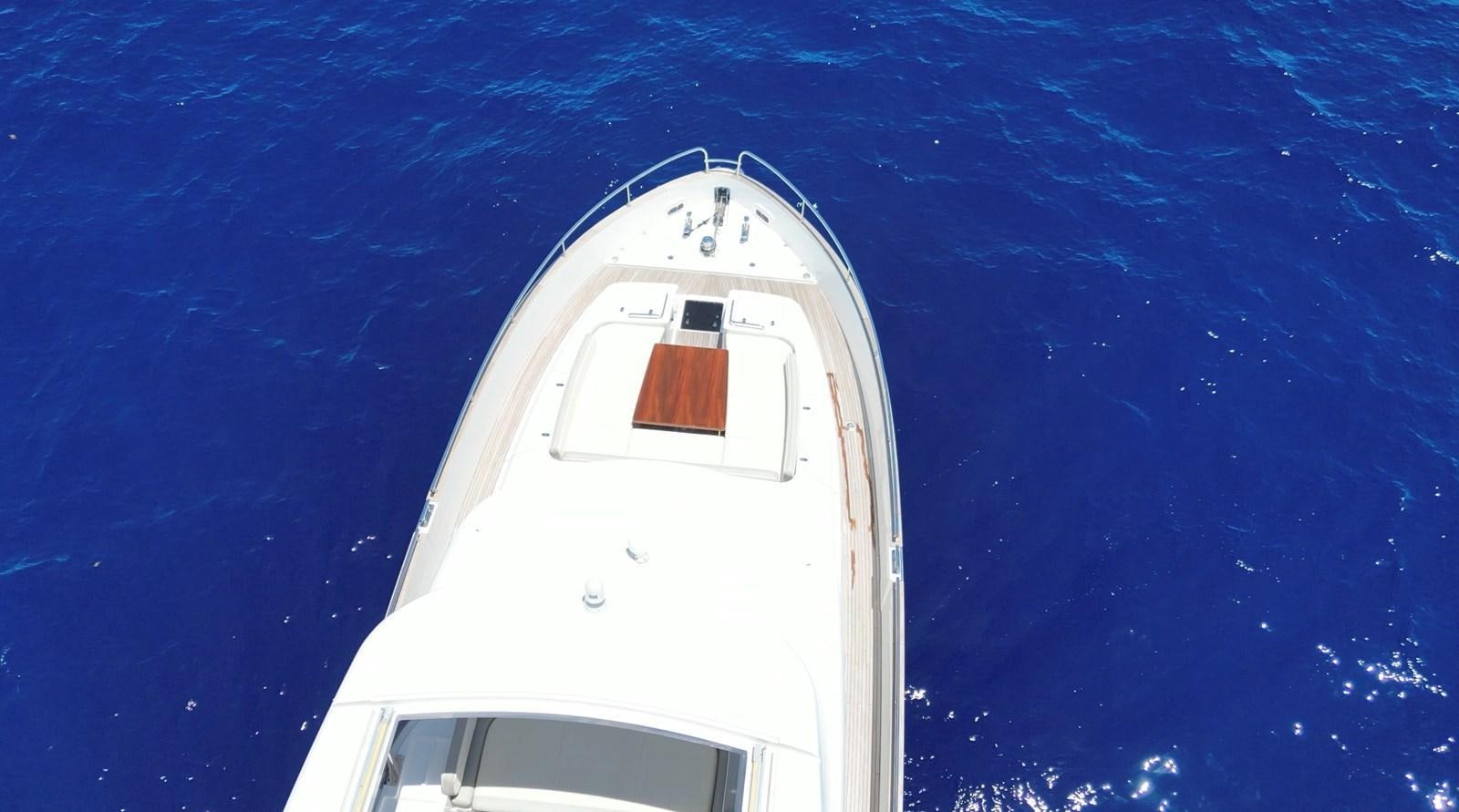 a white boat in the water aboard RAINBOW GODDESS Yacht for Sale