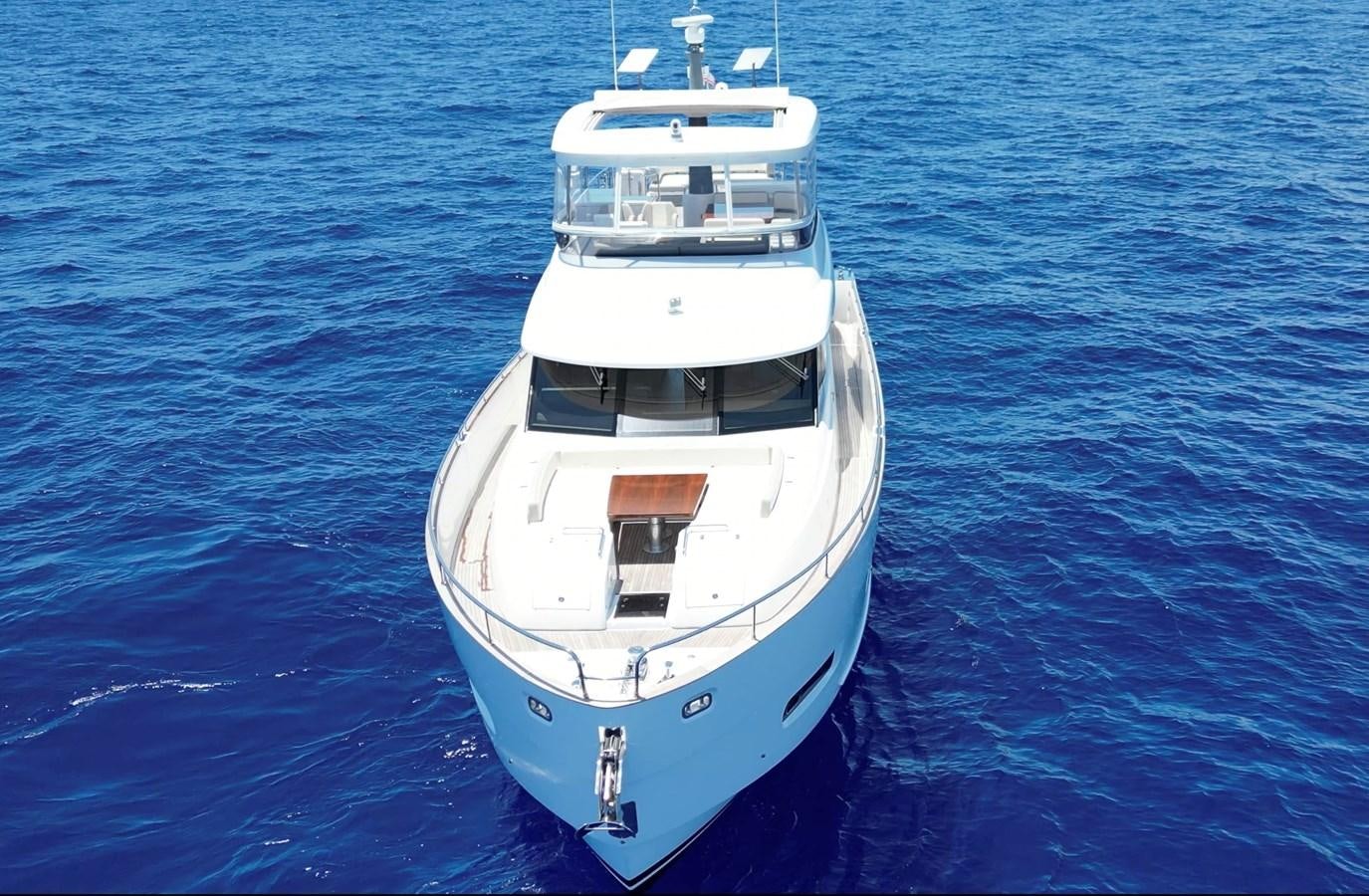 a white boat in the water aboard RAINBOW GODDESS Yacht for Sale