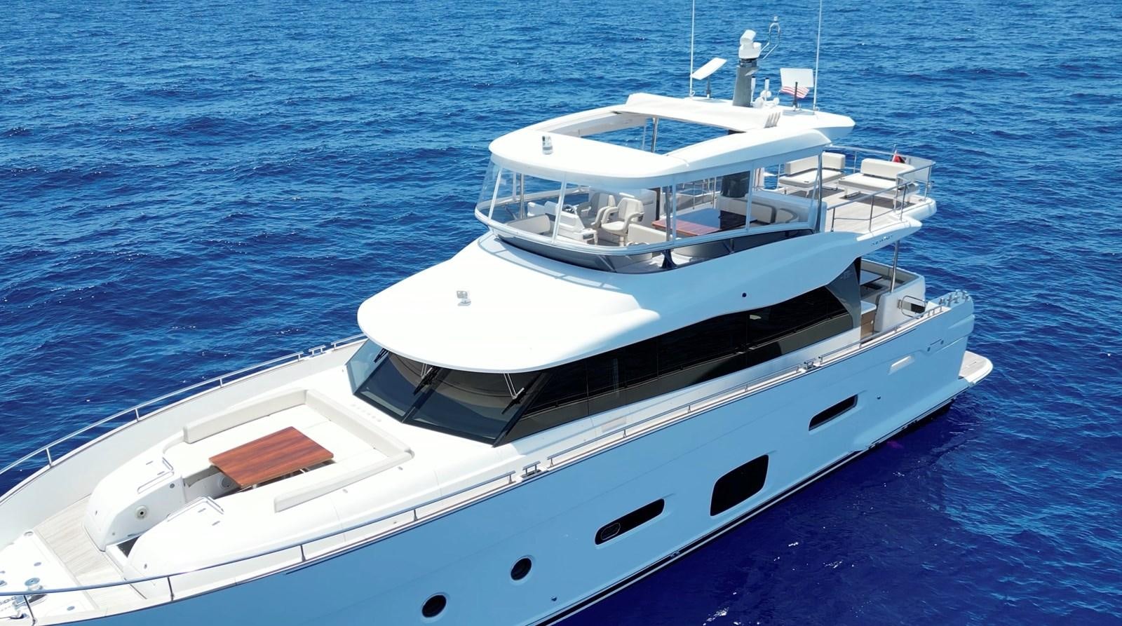 a white boat on the water aboard RAINBOW GODDESS Yacht for Sale