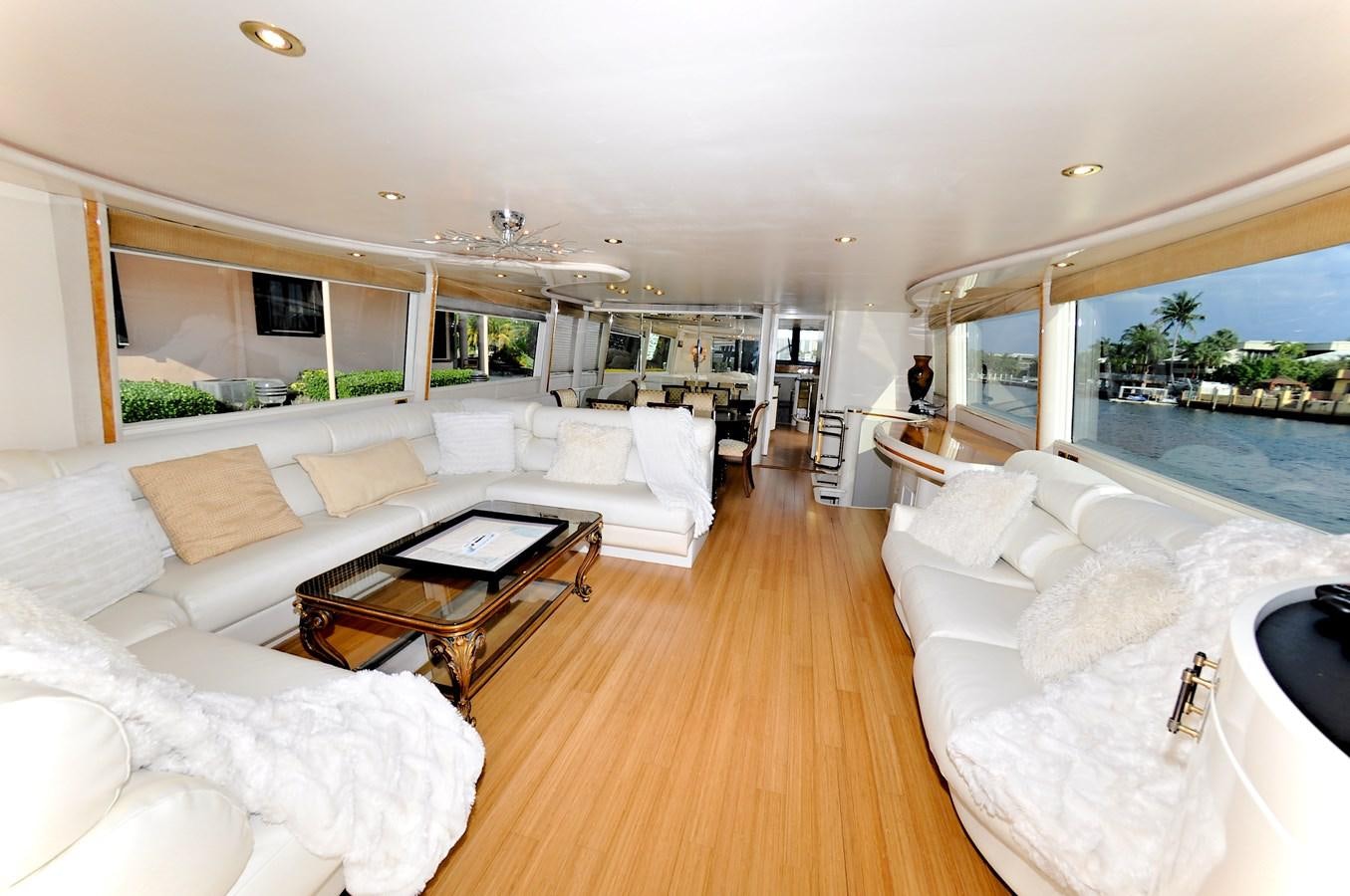 a living room with a large window aboard CAMY Yacht for Sale