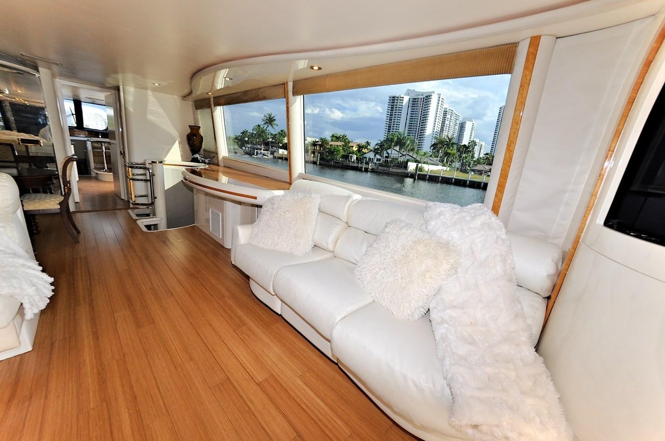a living room with a large window aboard CAMY Yacht for Sale