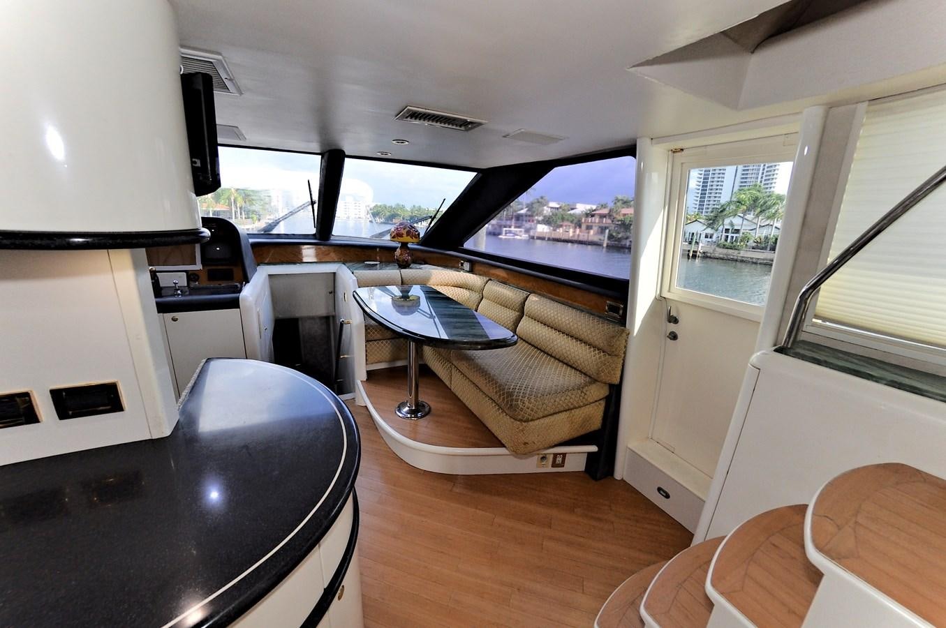 a living room with a couch and a table aboard CAMY Yacht for Sale