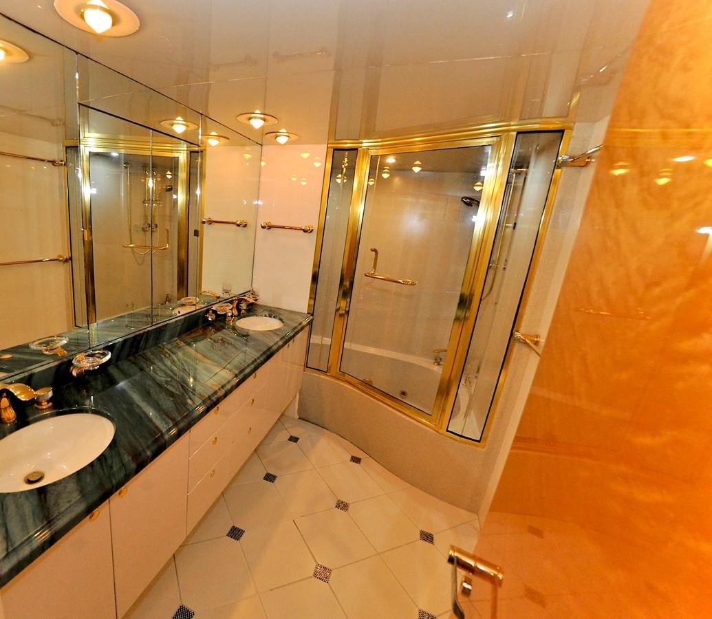 a bathroom with a large marble countertop aboard CAMY Yacht for Sale