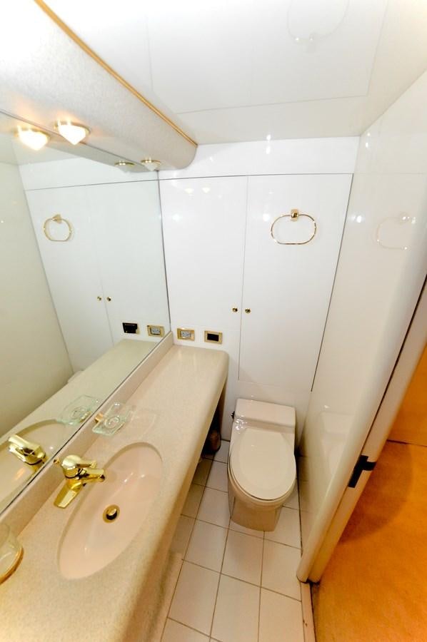 a bathroom with a sink and toilet aboard CAMY Yacht for Sale