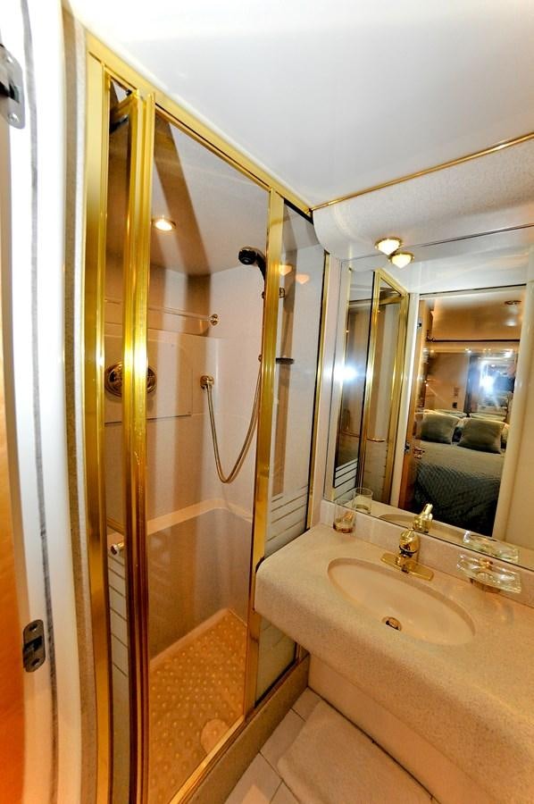 a bathroom with a shower and sink aboard CAMY Yacht for Sale