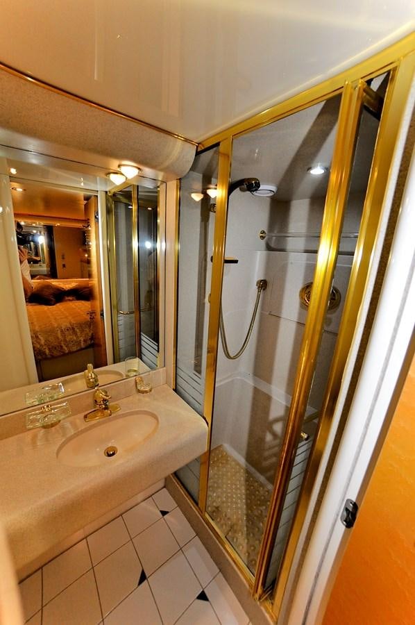 a bathroom with a large mirror aboard CAMY Yacht for Sale