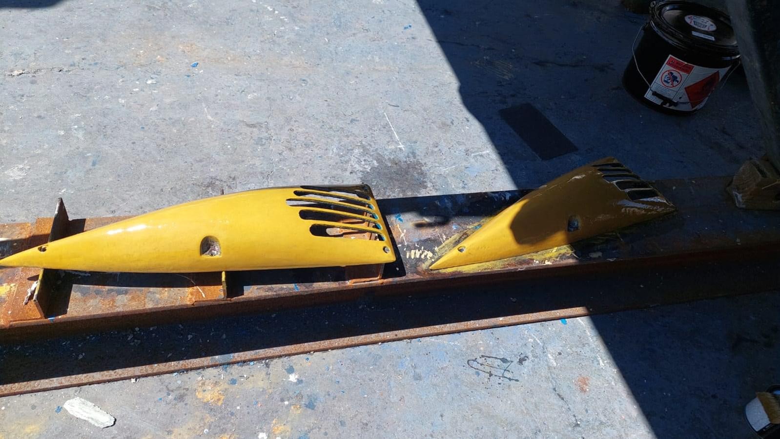 a yellow kayak on a wooden board aboard CAMY Yacht for Sale