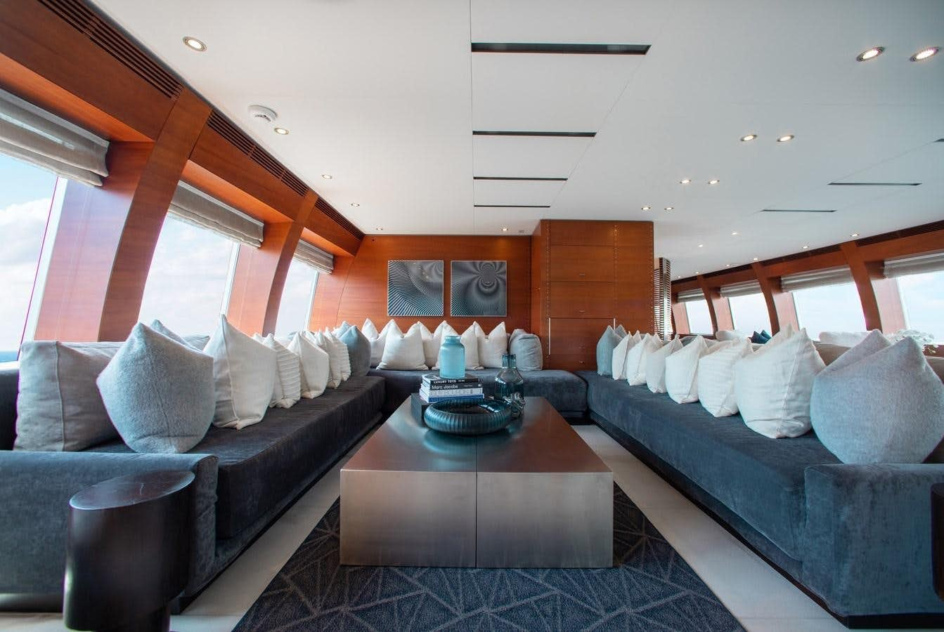 a living room with a couch and a coffee table aboard BLUE ICE Yacht for Sale