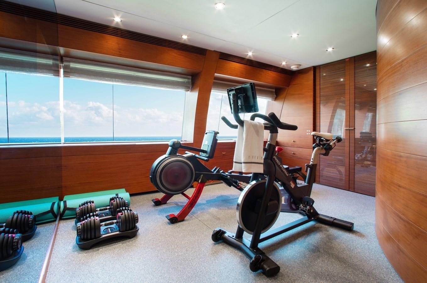 a gym with exercise equipment aboard BLUE ICE Yacht for Sale