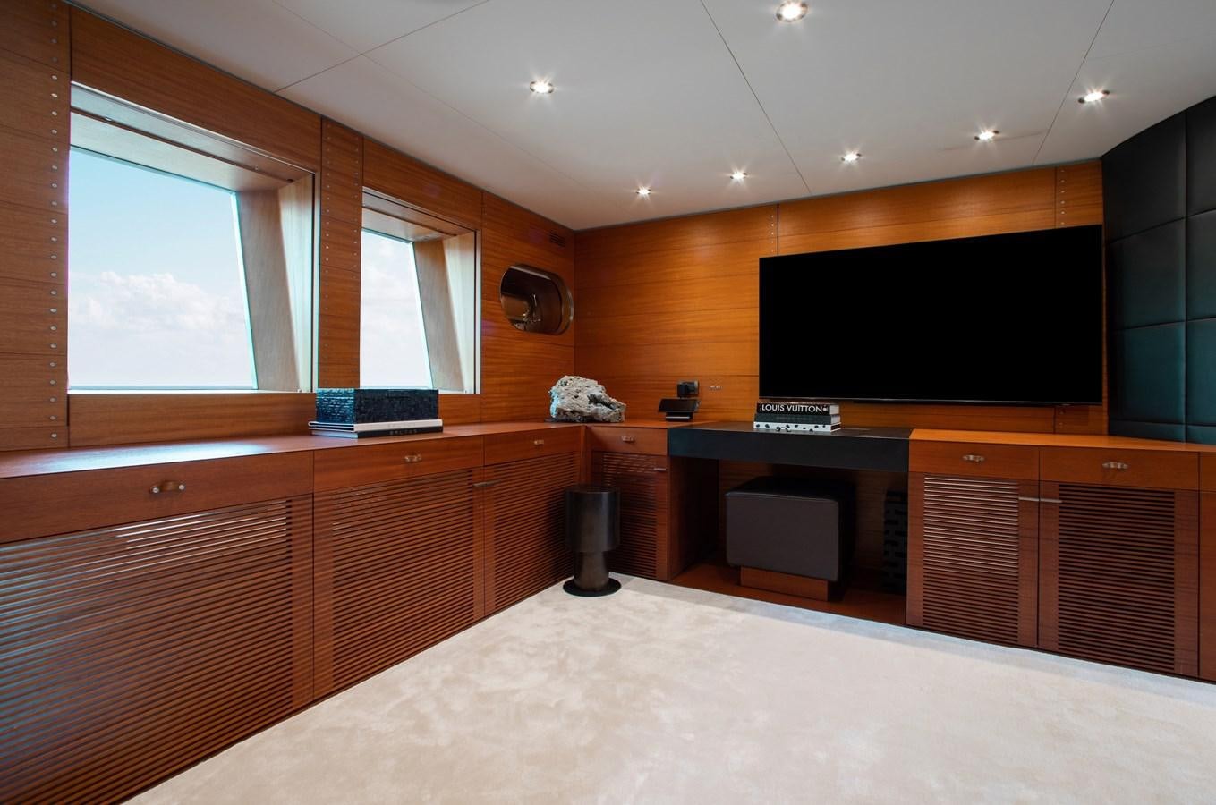 a room with a large bed and desk aboard BLUE ICE Yacht for Sale