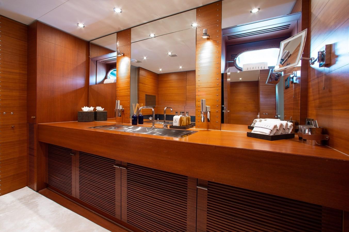 a kitchen with wooden cabinets aboard BLUE ICE Yacht for Sale
