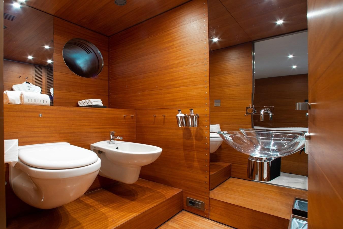 a bathroom with a large mirror aboard BLUE ICE Yacht for Sale