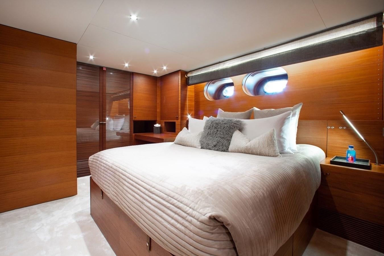 a bed with white sheets aboard BLUE ICE Yacht for Sale