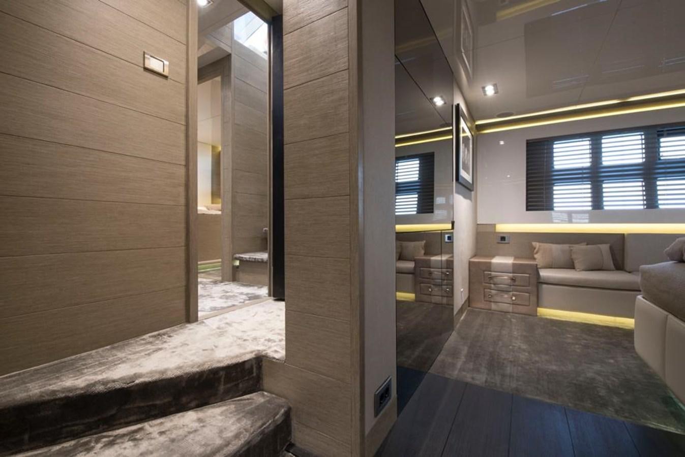 a room with a wood wall and a staircase aboard SUMMER BREEZE Yacht for Sale