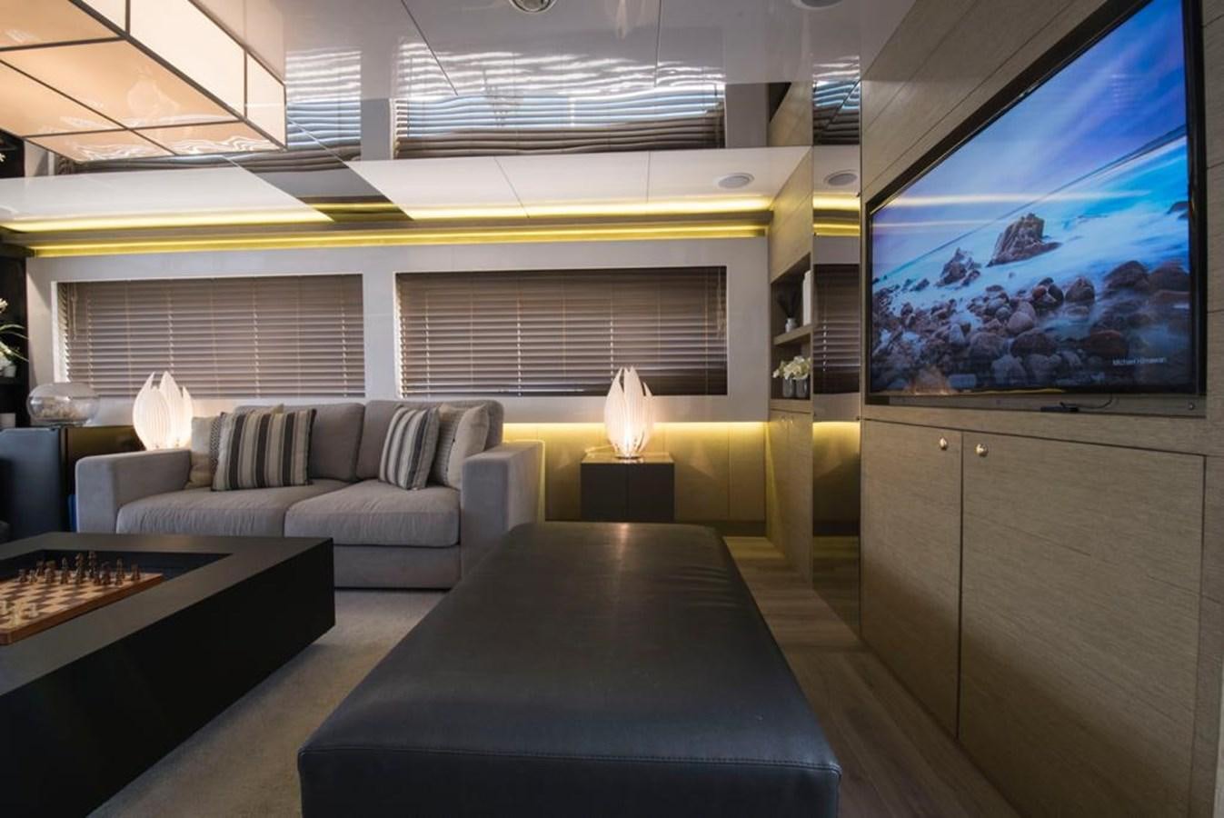 a room with a couch and a tv aboard SUMMER BREEZE Yacht for Sale