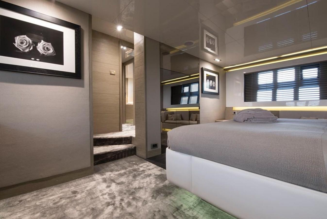 a bedroom with a bed and a window aboard SUMMER BREEZE Yacht for Sale