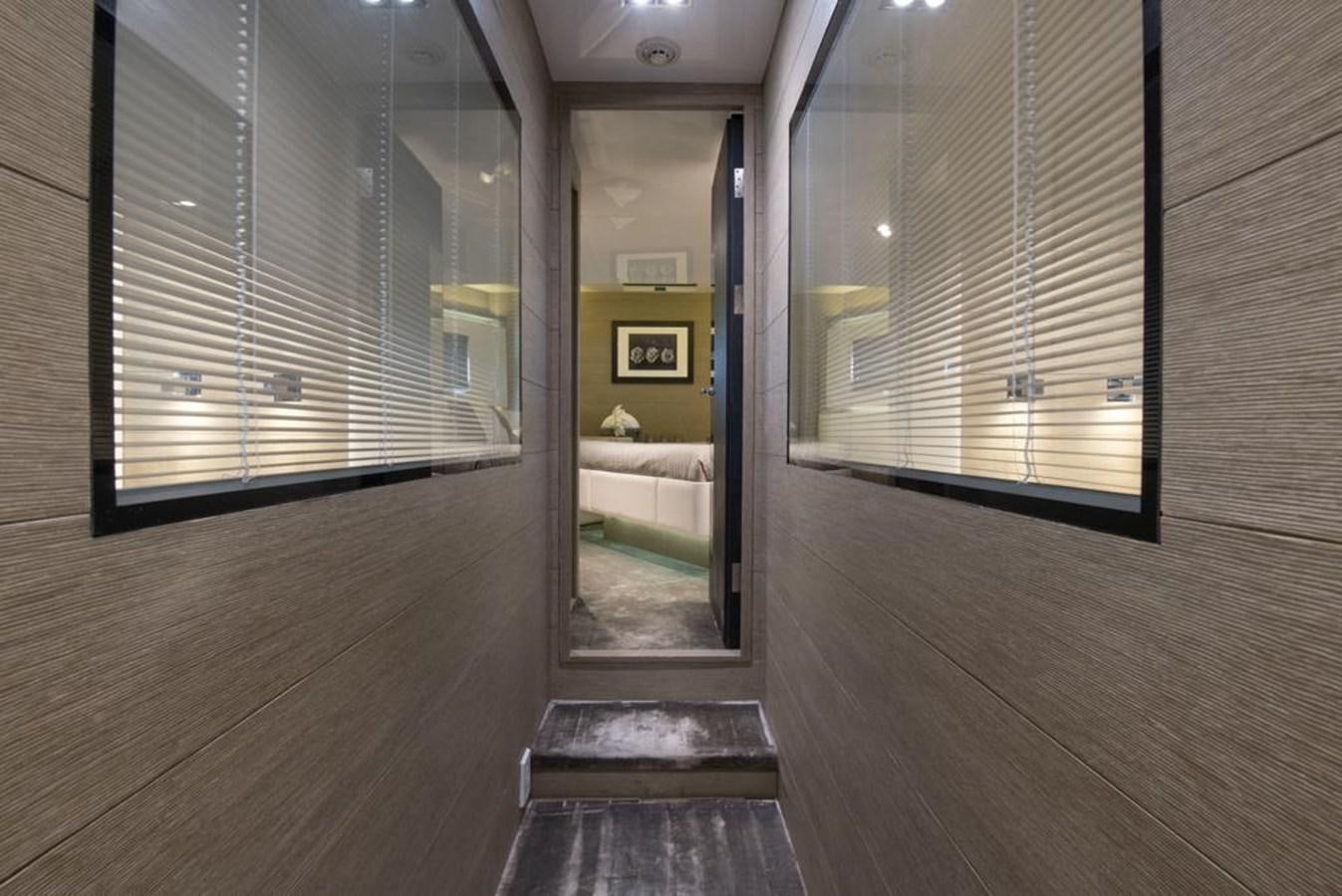 a room with a wood floor and a door with a window aboard SUMMER BREEZE Yacht for Sale