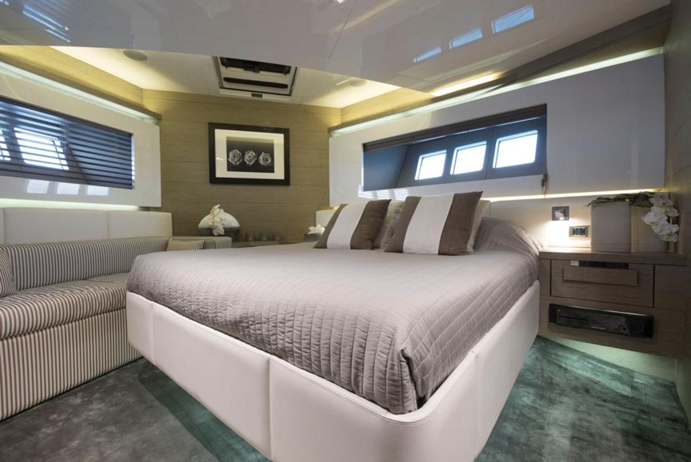 a room with a bed and a television aboard SUMMER BREEZE Yacht for Sale