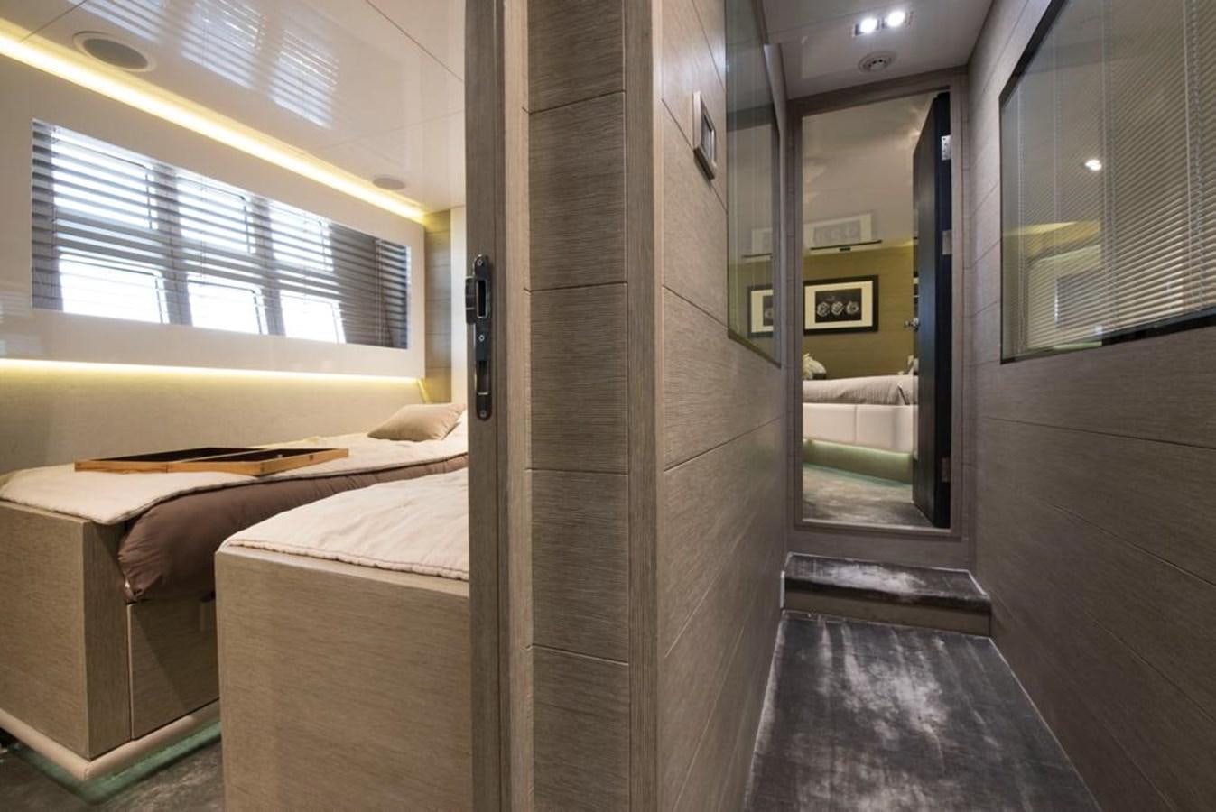 a room with a bed and a mirror aboard SUMMER BREEZE Yacht for Sale
