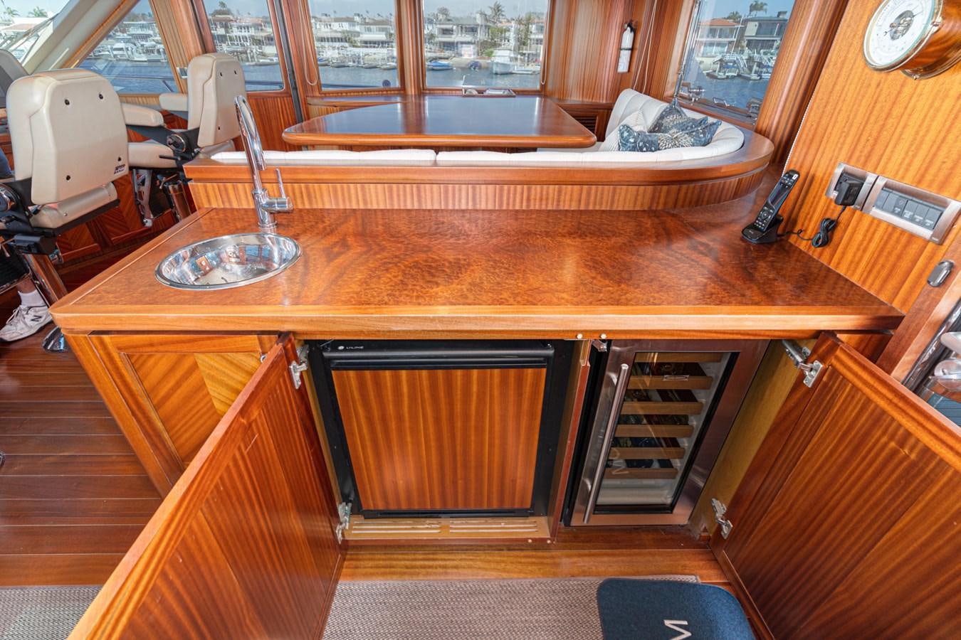 a kitchen with a table and cabinets aboard PHANTOM Yacht for Sale