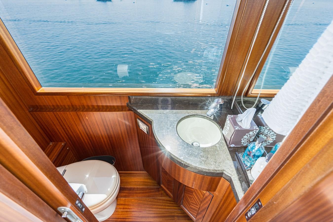 a bathroom with a sink and a toilet aboard PHANTOM Yacht for Sale