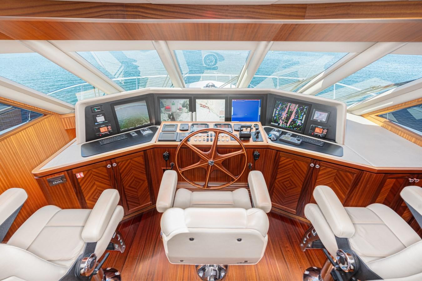 a room with a desk and chairs aboard PHANTOM Yacht for Sale