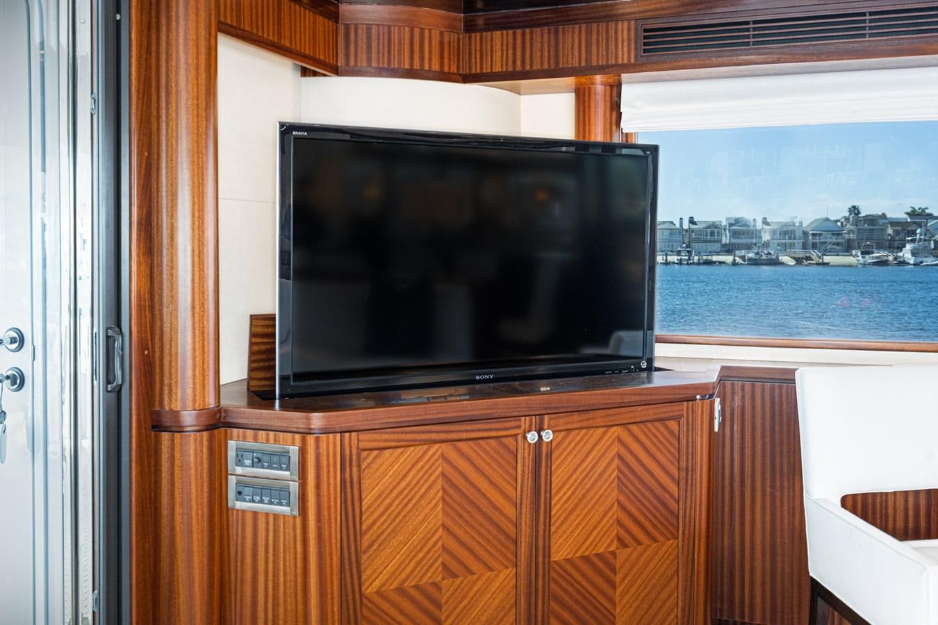 a tv on a cabinet aboard PHANTOM Yacht for Sale