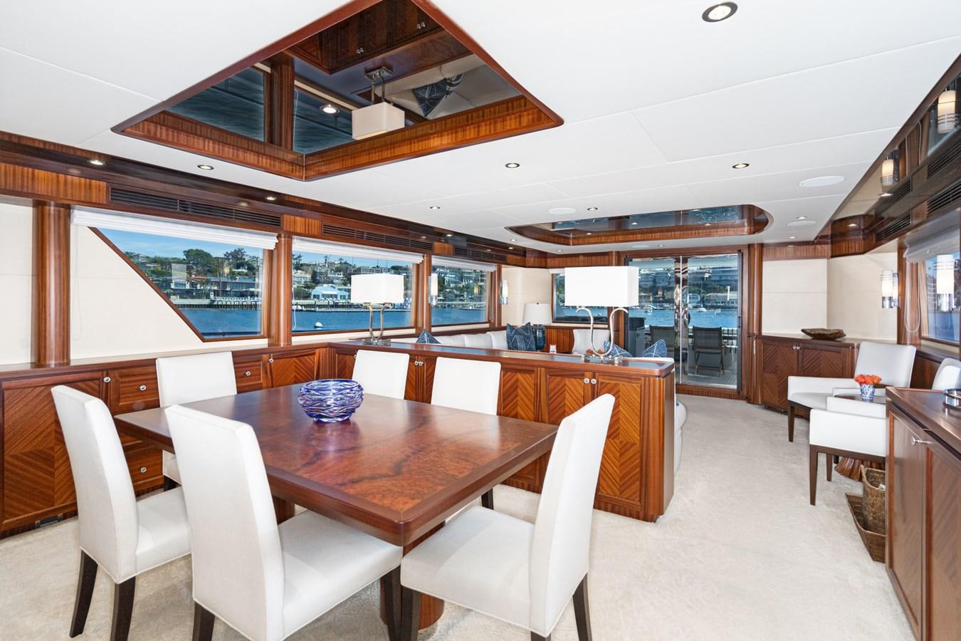a room with a table chairs and a large window aboard PHANTOM Yacht for Sale