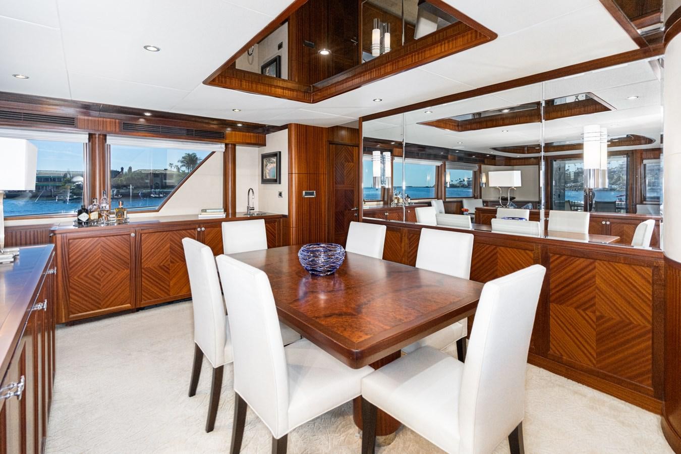 a room with a table chairs and a large window aboard PHANTOM Yacht for Sale