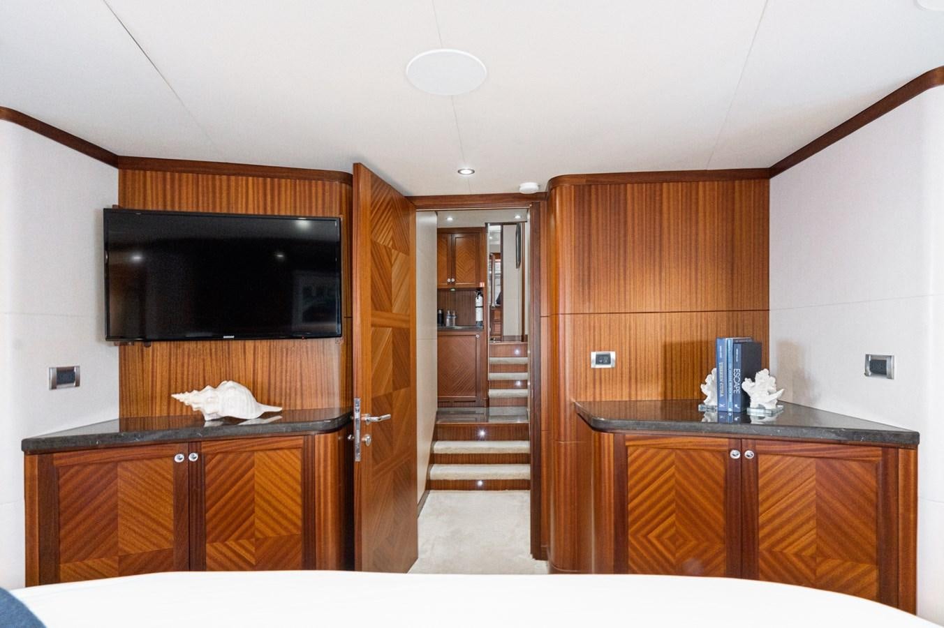 a kitchen with wooden cabinets aboard PHANTOM Yacht for Sale